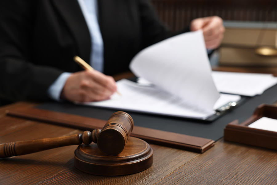 reviewing court documents on a desk with a gavel